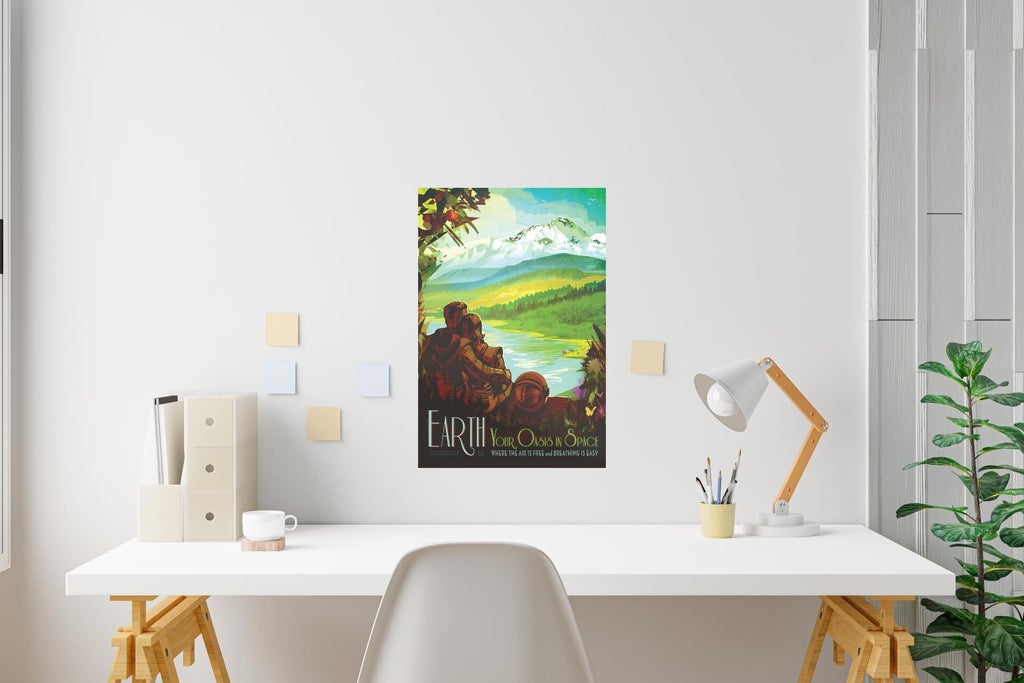 A free photo print design created by NASA's design team depicts two space travelers returning to Earth.